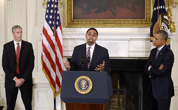 WASHINGTON, DC - OCTOBER 02: Deputy Education Secretary John B. King Jr. (C) delivers remarks after being nominated by U.S. President Barack Obama (R) to replace outgoing Education Secretary Arne Duncan (L) in the State Dining Room at the White House October 2, 2015 in Washington, DC. Obama praised the work of Duncan, one of the few remaining members of the president's original cabinet. (Photo by Olivier Douliery - Pool/Getty Images)